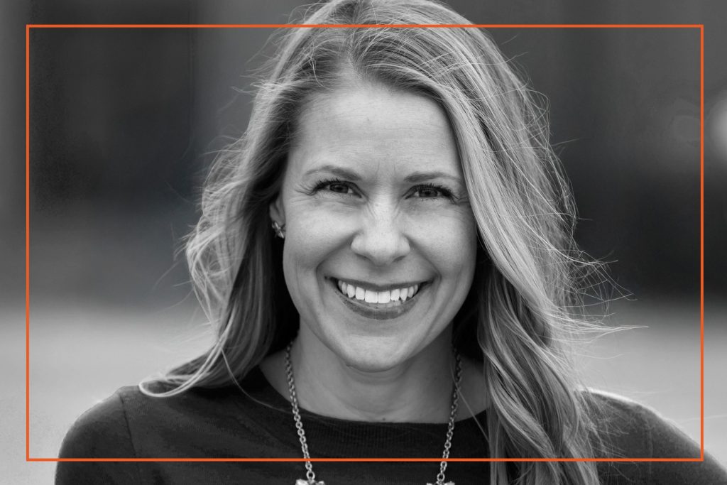 Portrait of a smiling woman representing Co-hesion, experts in cultural change, leadership, and execution.